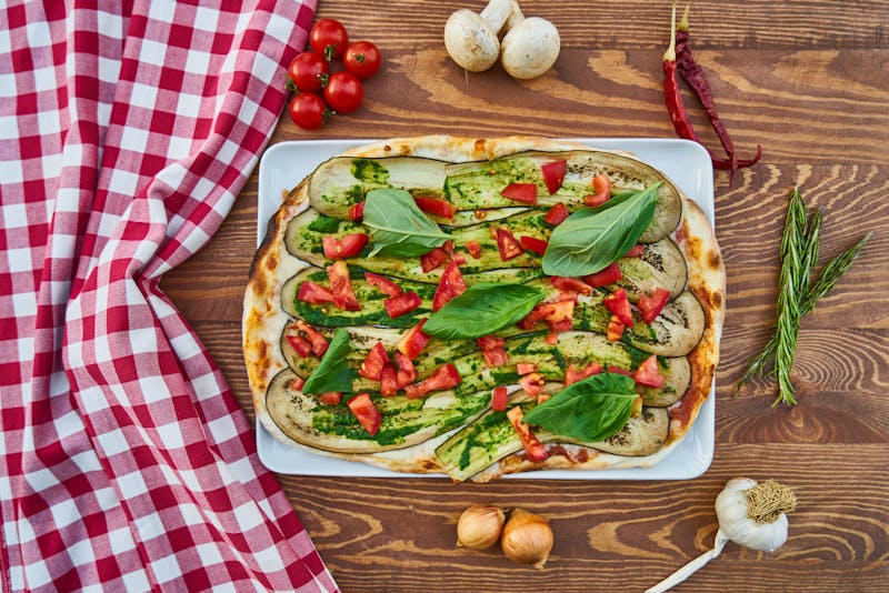 Fresh vegetable garden deep dish pizza with colorful seasonal toppings